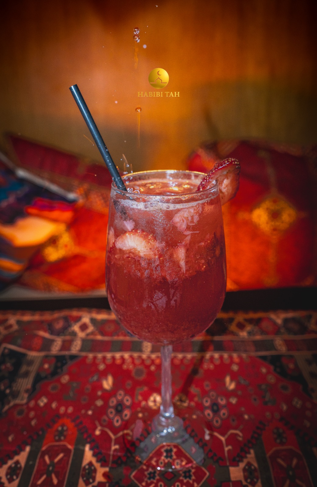 Habibi Tah strawberry drink with warm restaurant lighting